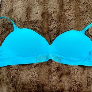 Very vibrant aqua color Victoria secret bra with shiny logo